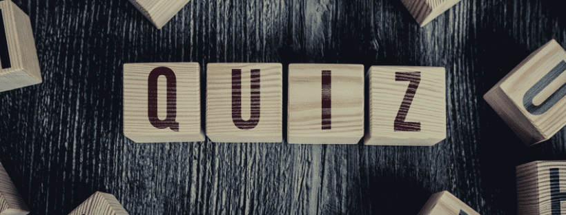 wooden blocks with individual letter, assembled to read the word 'quiz'