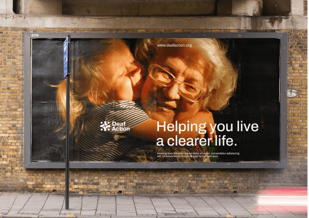 Billboard showing a deaf actoin poster of a young girl hugging and older woman. Text reads 'helping you live a clearer life'