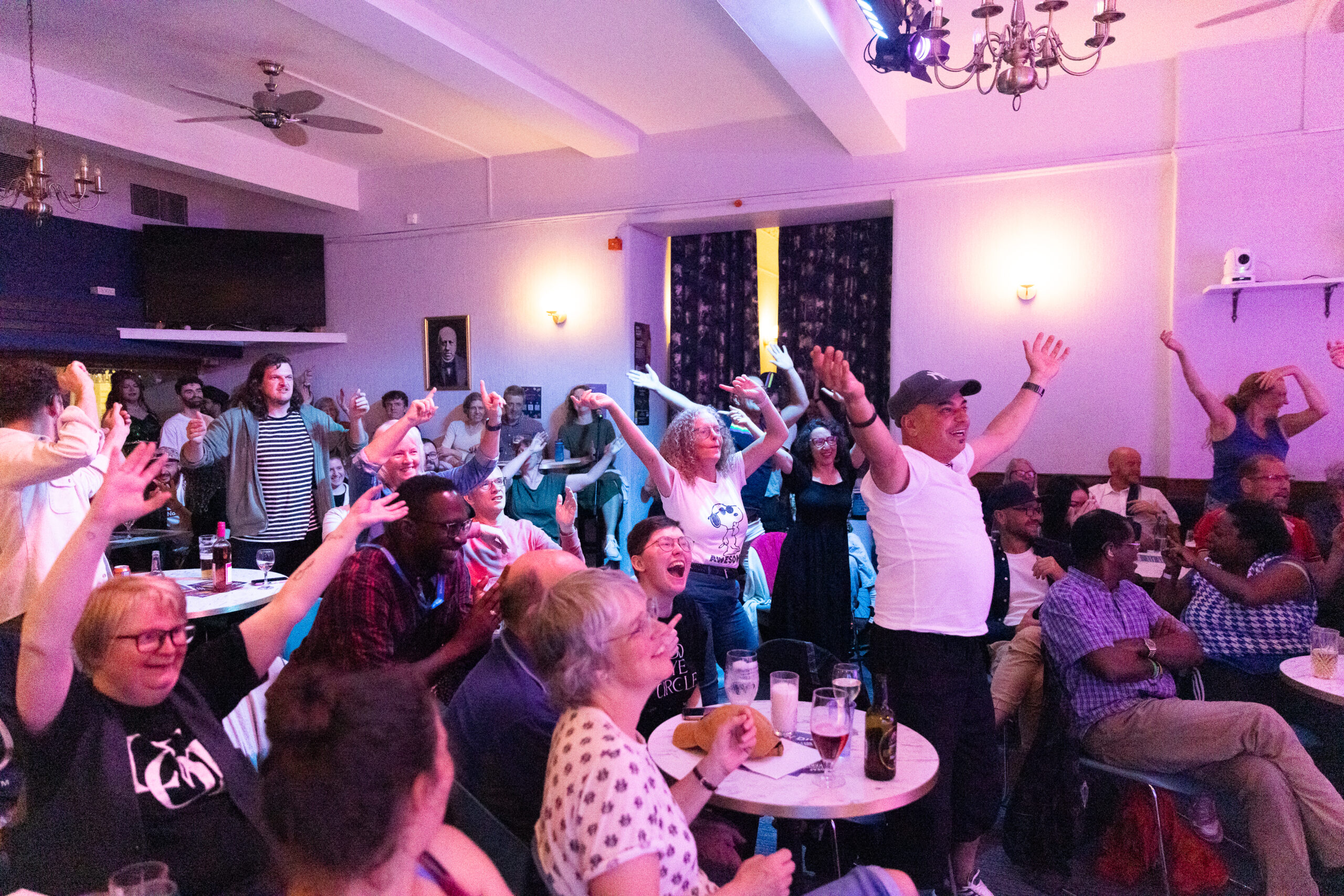 People standing and sitting enjoying themselves at the Blackwood Bar